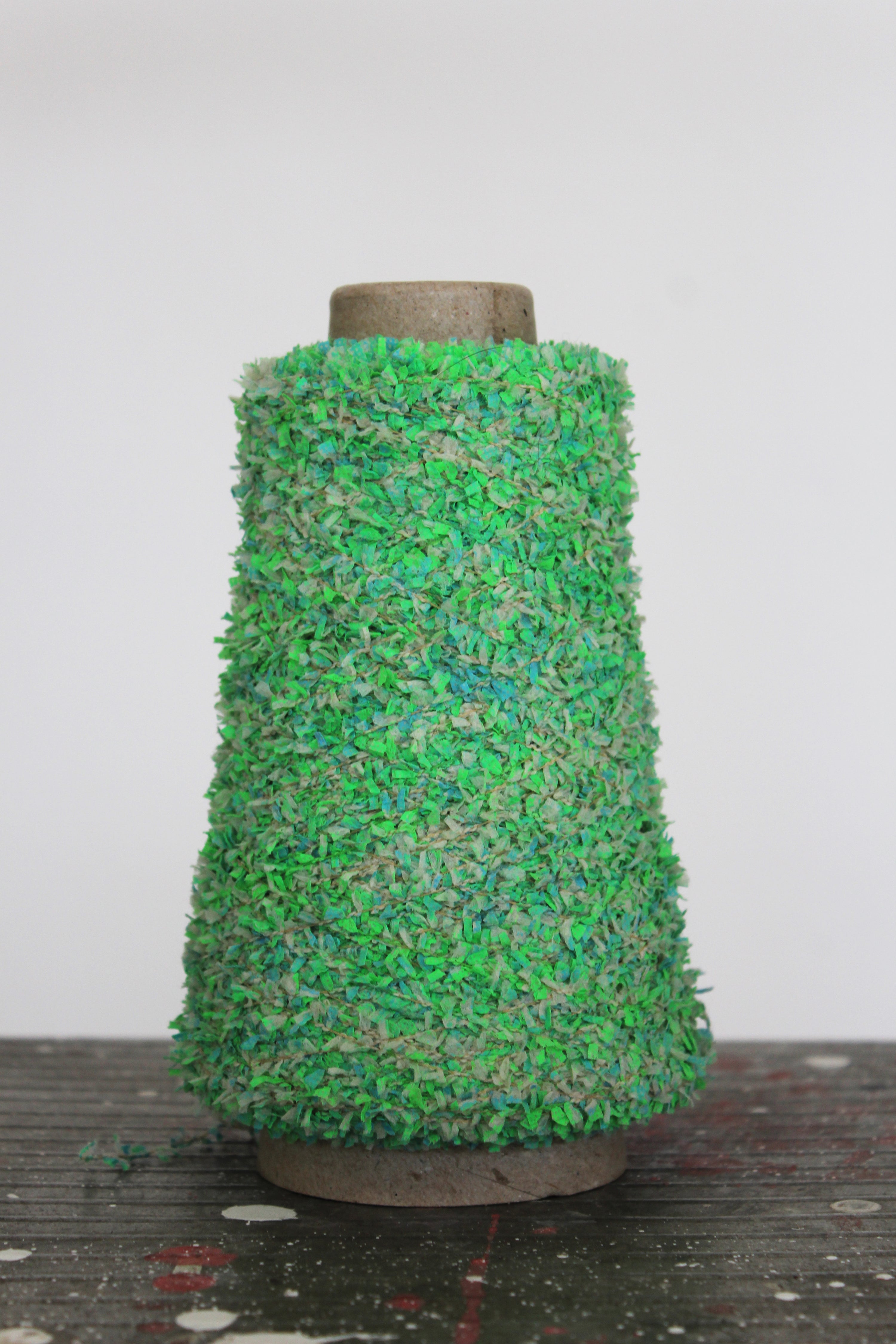 TWISTED NON-WOVEN CUT YARN — COATED